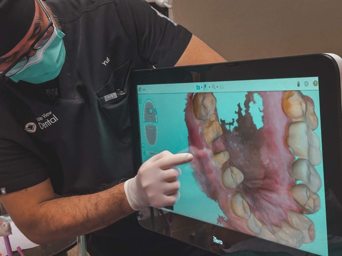 Dental assistant viewing digital scan for same-day dental crowns in Romeoville, IL Valley View Dental office